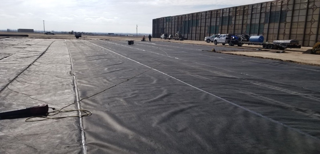 Contaminant protection, like this membrane placement, is protecting the ground from leakage or damaging chemicals. One of many services we offer at Fortress Development Solutions.