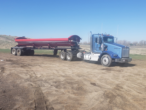 Our Hauling And Trucking Team At Fortress Development Solutions. From Heavy Hauling To Water Delivery And More, We Do It All.